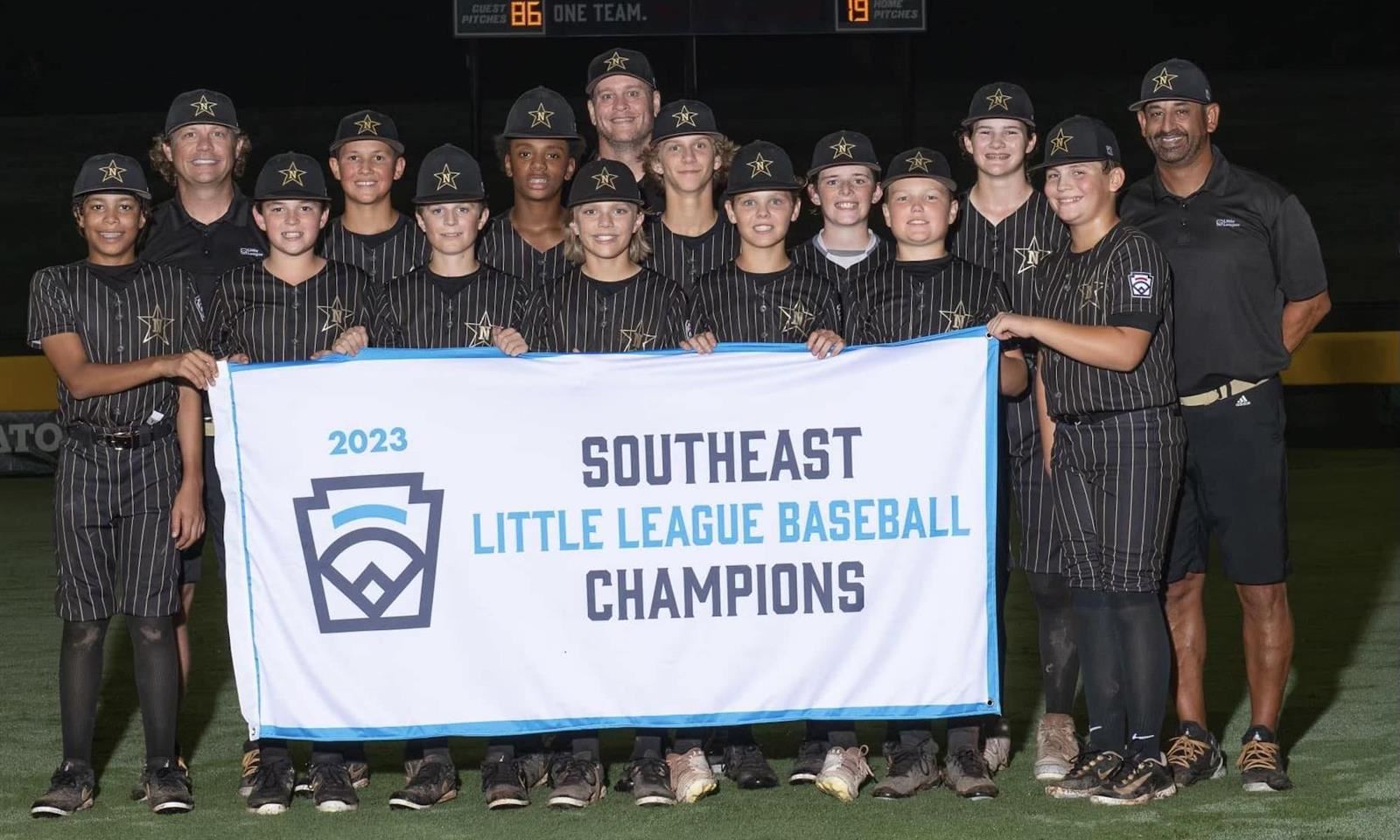 A baseball team smiles